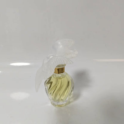 020926-360 Nina Ricci fly together