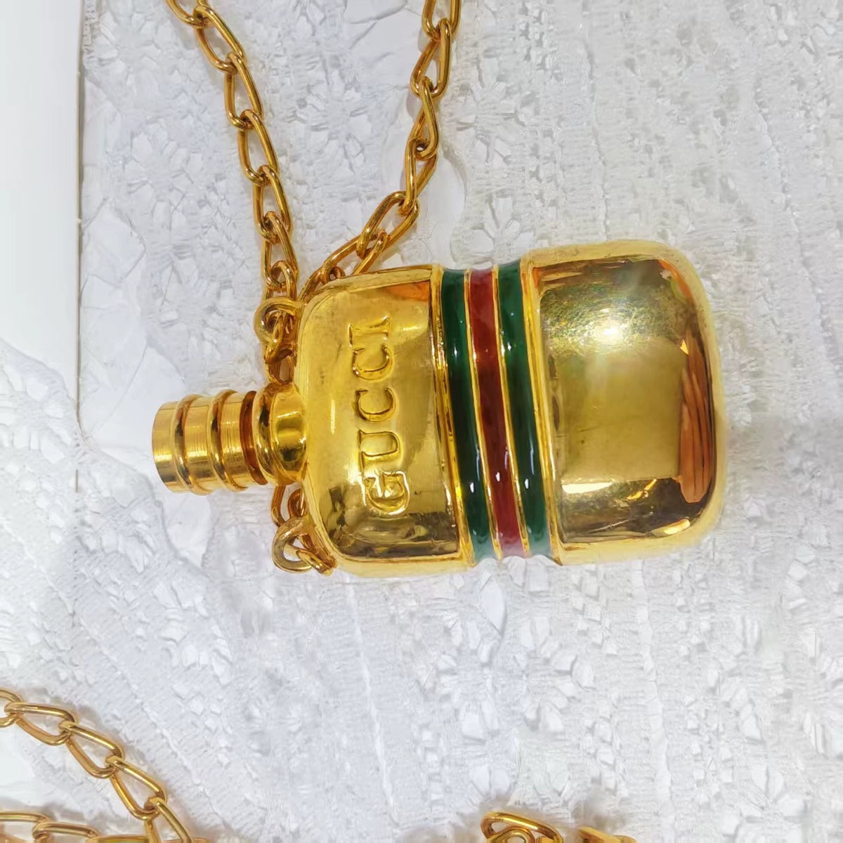 020926-354 Gucci bottle necklace gold Perfume