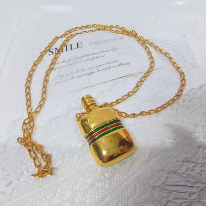 020926-354 Gucci bottle necklace gold Perfume